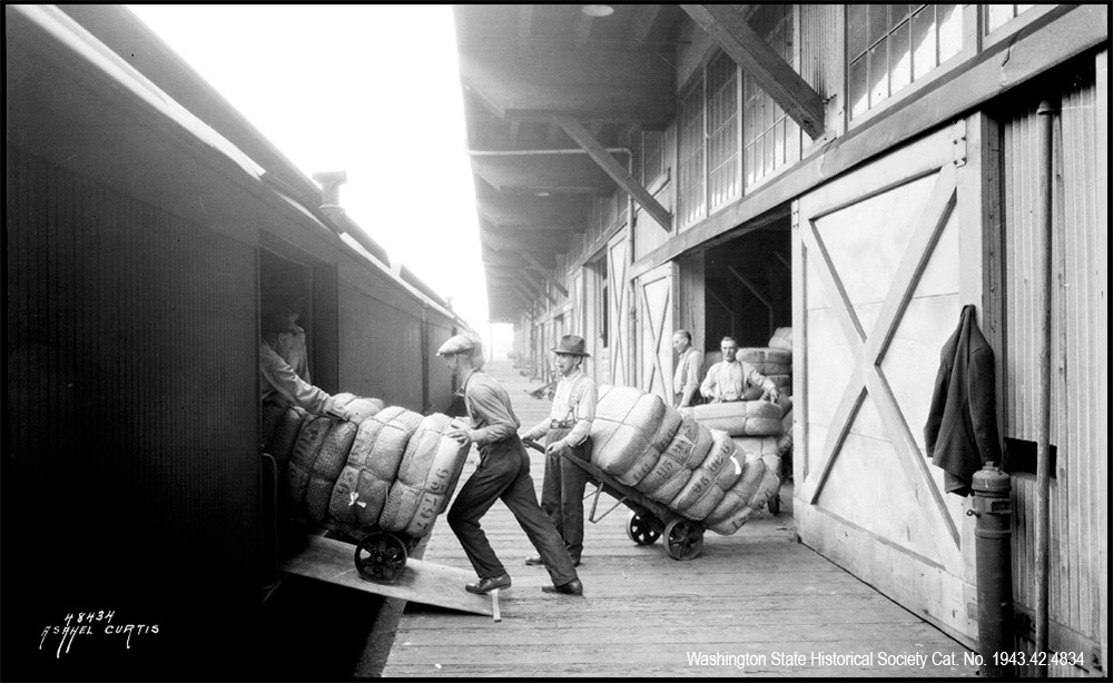 Loading the Express Cars, the silk has been inspected by Customs officials and is being loaded